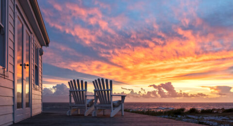 Two Ampty Chairs Facing Magnificent Sunset View at Beach