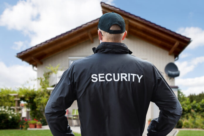 Security Guard Standing Outside The House